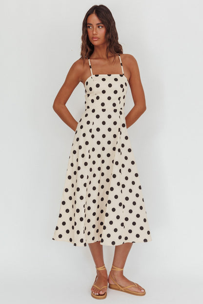 Abito midi a pois beige con scollo incrociato sulla schiena