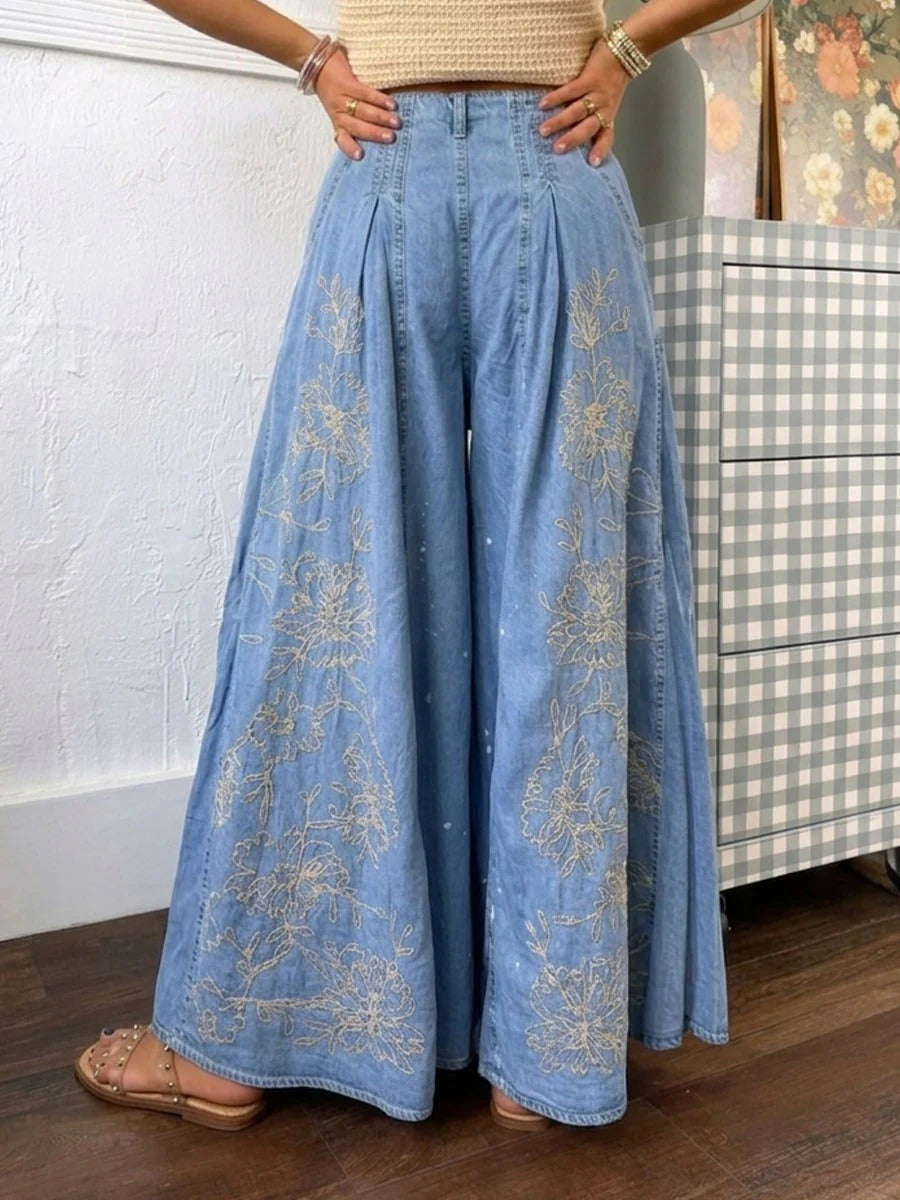 Jeans Noir a zampa larga in denim con ricami e stampe