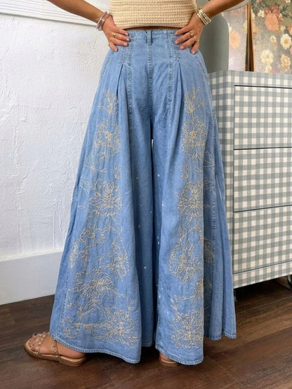 Jeans Noir a zampa larga in denim con ricami e stampe