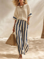 Set composto da top in misto cotone e lino con effetto testurizzato e blocchi di colore e pantaloni a gamba larga con elastico in vita a righe blu e bianche