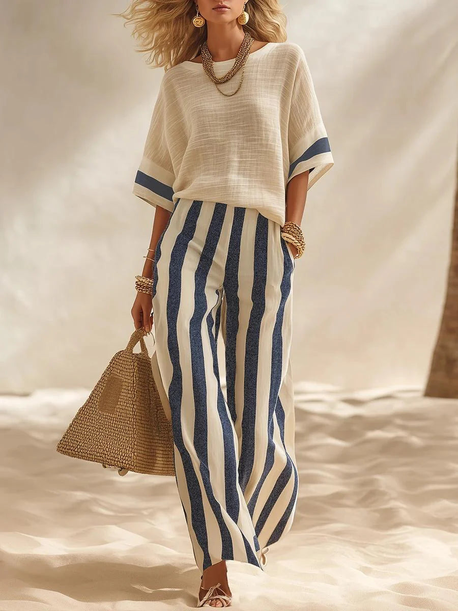 Set composto da top in misto cotone e lino con effetto testurizzato e blocchi di colore e pantaloni a gamba larga con elastico in vita a righe blu e bianche