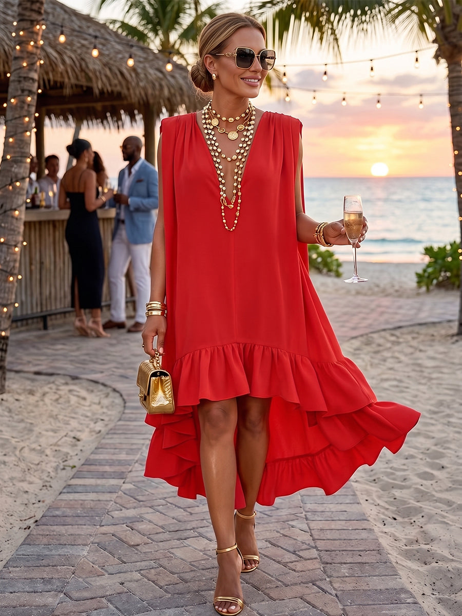 Elegante abito midi asimmetrico con volant, perfetto per feste in vacanza.