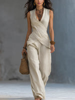 Completo da donna in cotone e lino composto da top con motivo incrociato e pantaloni a gamba larga.
