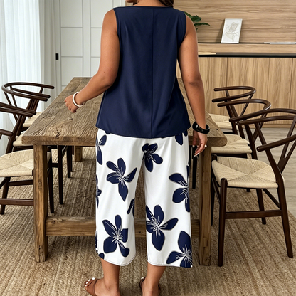 ✨ Completo da donna composto da top asimmetrico e pantaloni capri con fantasia floreale: versatile, colorato e comodo 🌺