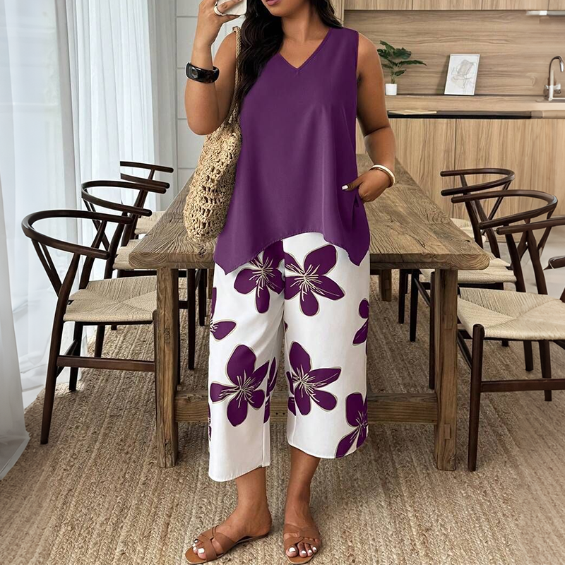 ✨ Completo da donna composto da top asimmetrico e pantaloni capri con fantasia floreale: versatile, colorato e comodo 🌺