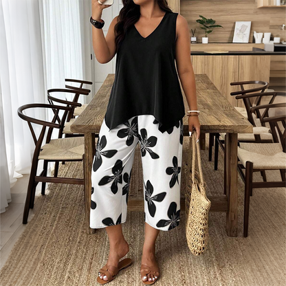 ✨ Completo da donna composto da top asimmetrico e pantaloni capri con fantasia floreale: versatile, colorato e comodo 🌺