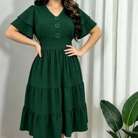 Abito midi da donna con scollo a V e maniche a volant.